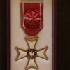 Przekazanie orderu, przyznanego pośmiertnie, ks. R. Marszałkowi SChr